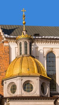 Gilded dome of the Cathedral Basilica of St. Stanislaus and Wenceslas in Krakow, Poland, at the Wawel Hill  where Royal Castle is located.