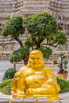 Buddha’s statue at the entrance to Wat Arun, Temple of Dawn in Bangkok, Thailand.