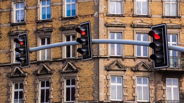 Traffic lights on the background of an old building in Bytom, Poland.