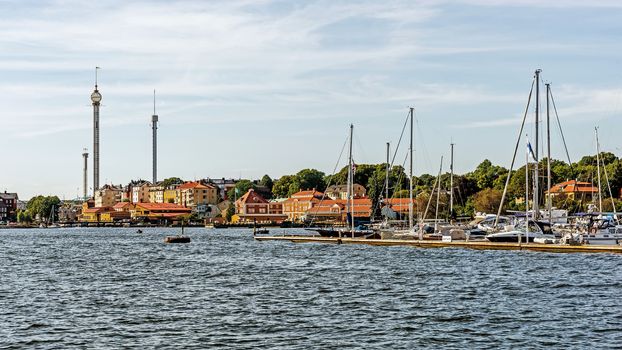 Distant view on Grona Lund, the amusement park on the Djurgarden Island in Stockholm. The park is located amongst the old 19th century buildings originally designed not for the park.