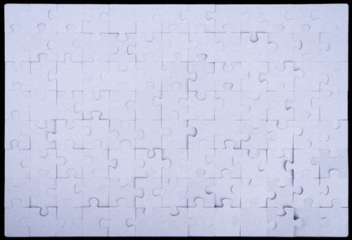 Grey puzzle set pieces on black background