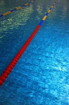 Swimming pool with lane markers. Vertical photo