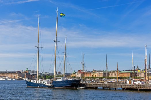 Sailboat moored in front of the Vasa Museum on the Djurgarden island. In the background Strandvagen, boulevard considered the most prestigious avenue in town.