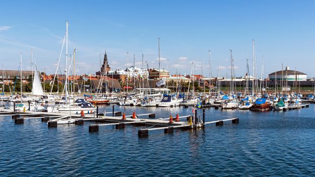 Marina and Ystad skyline. City founded in 11th century is a busy ferry port and the place of action of well-known novels by Henning Mankell with detective Wallander.