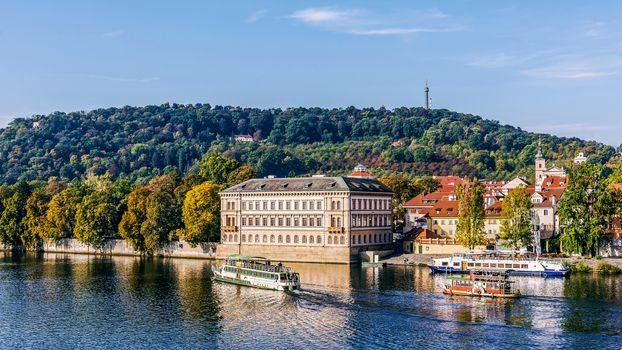 Boats on the Vltava River in Prague, the capital of the Czech Republic, home to many attractions, the Prague Castle, the Charles Bridge, Old Town and St. Vitus Cathedral.