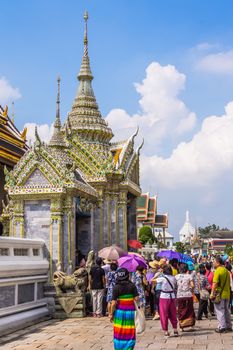 Tourists in the area of The Grand Palace in Bangkok, historical seat of Kings of Siam, main tourist attraction of the city, still used for official events.
