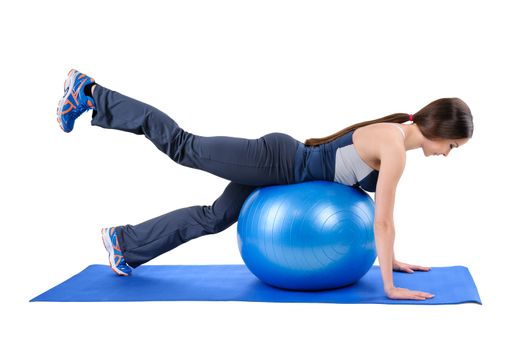 Young woman shows starting position of Fitness Stability Ball Glute Kickback Workout, isolated on white