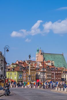 The Castle Square with Sigismund's Column in the middle and Old Town skyline. Place is the main tourist attraction of Warsaw, always crowded with tourists.