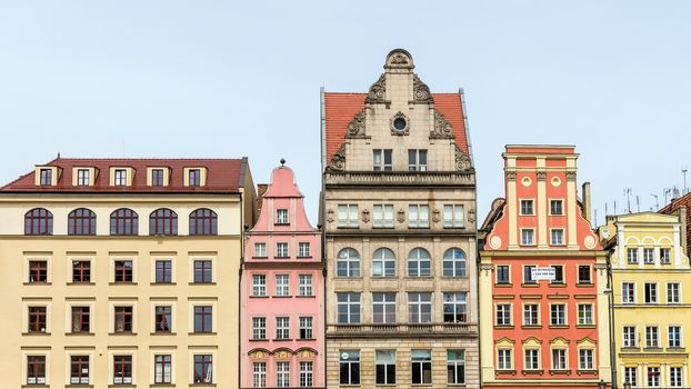 Facades of ancient tenements in the 13th century Main Market Square in Wroclaw, one of the largest markets in Europe, with the largest two town halls in Poland.