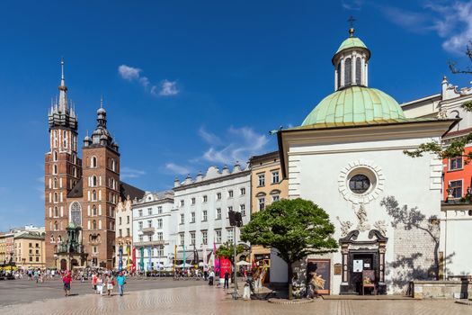St. Adalbert (in the foreground) and St. Mary churches in the Main Square. Krakow is the most popular destination in Poland, full of many attractions for tourists.