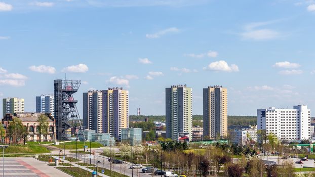 Cityscape of Katowice with the Silesian Museum arranged in the former coal mine "Katowice". The complex combines old mining infrastructure with modern dynamic architecture.