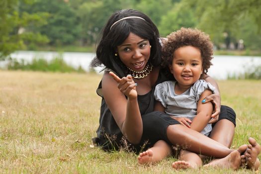 Pregnant mother and her daughter are having fun