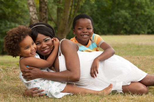 African mother and her kids are having fun in the nature