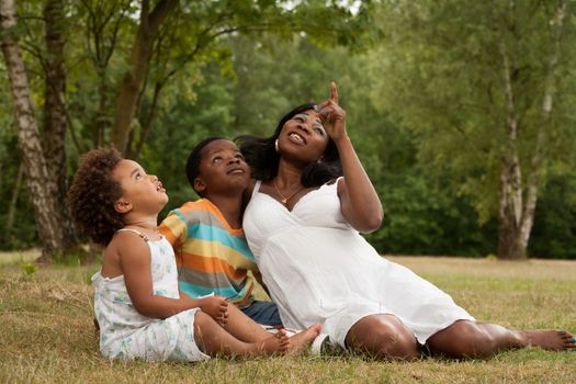 African mother and her kids are having fun in the nature