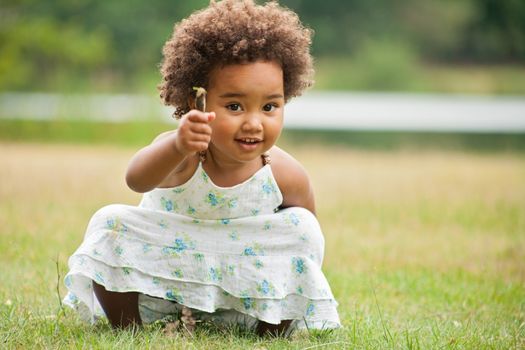 African young girl is having fun outside