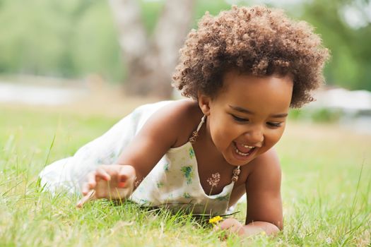 African young girl is having fun outside