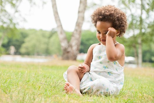 African young girl is having fun outside