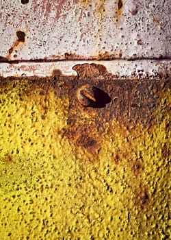 abstract background or texture rusty screw to the yellow plate steel