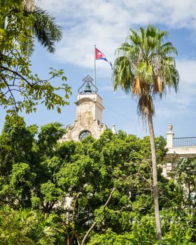 In the picture the Cuban flag placed on a bell tower in the center of Havana