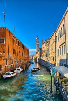 Scenic canal with Carabinieri boats, Venice, Italy, HDR