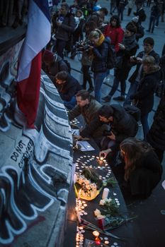 FRANCE, Paris: Crowds gathered in Paris to remember the dead and leave flowers and tributes for the attack victims on November 14, 2015. Scenes at the Place de la Republique.