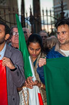 ITALY, Palermo: Italians light candles and stand in solidarity with the victims of the Paris attacks in the main square of Palermo on November 14, 2015. 