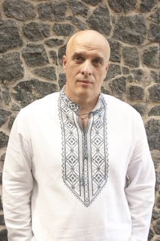 The man in the classic Ukrainian embroidered shirt. Folk Ukrainian style.