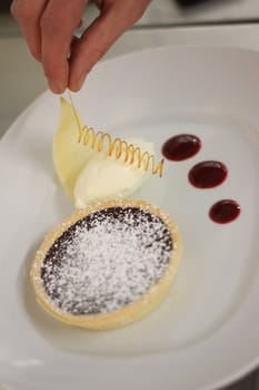 chocolate tart dessert with coulis