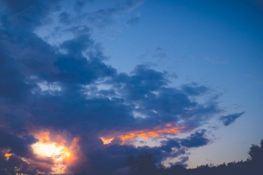 The silhouette of the city skyline during sunset, expressive sky, nature background