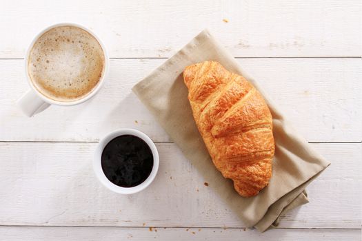 fresh baked croissant with coffee