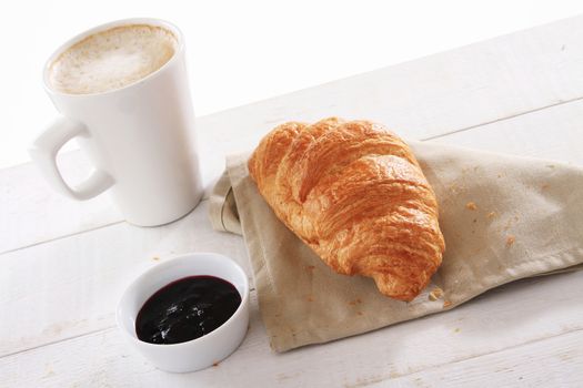 fresh baked croissant with coffee