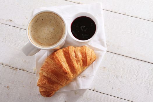 fresh baked croissant with coffee