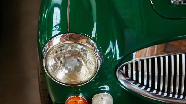 Detail of classic car. Close-up of headlight