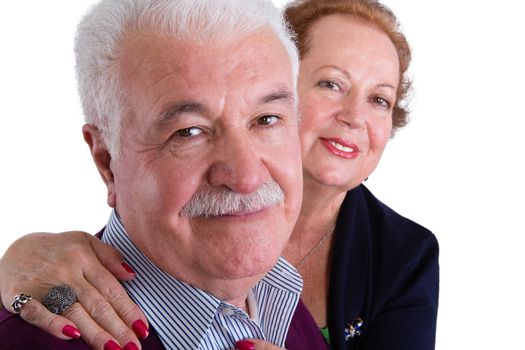 Close up Happy Senior Business Couple Smiling at the Camera Against White Background.