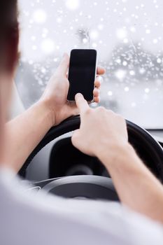 transportation, people, technology and vehicle concept - close up of man using smartphone while driving car