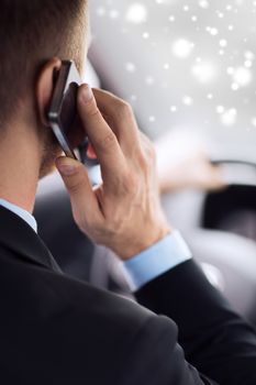 transportation, people, technology and vehicle concept - close up of man using smartphone while driving car