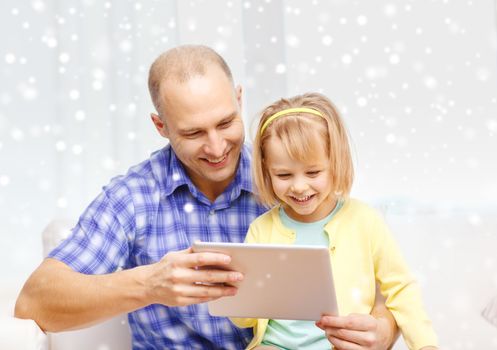 family, children, technology and people concept - happy father and daughter with tablet pc computer at home