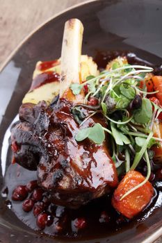 roast lamb shank plated meal