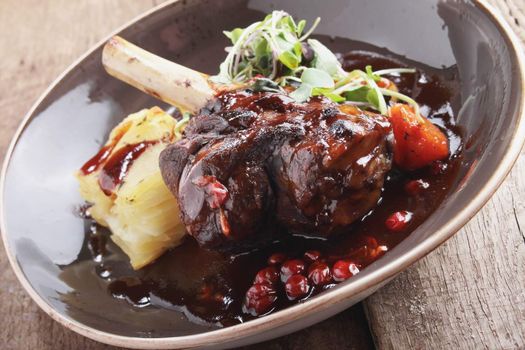 roast lamb shank plated meal