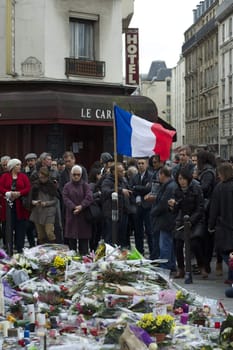FRANCE, Paris: People gathered at Le Carillon restaurant, one of the Paris attacks' crime scenes, to participate in a minute of silence for the victims of the attacks, on November 16, 2015. At least 129 people were killed and more then 350 critically injured in a series of overnight terror attacks in Paris from 13 to 14 November 2015.