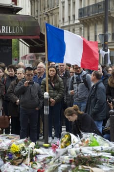 FRANCE, Paris: People gathered at Le Carillon restaurant, one of the Paris attacks' crime scenes, to participate in a minute of silence for the victims of the attacks, on November 16, 2015. At least 129 people were killed and more then 350 critically injured in a series of overnight terror attacks in Paris from 13 to 14 November 2015.