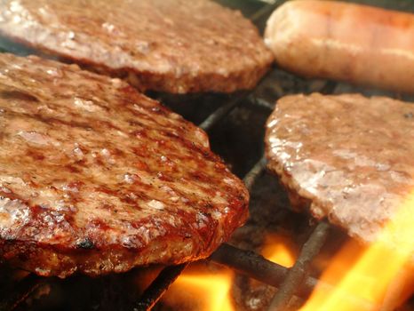 burgers cooking on barbecue