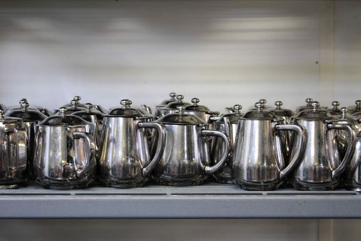 metal teaand coffee pots in commercial kitchen