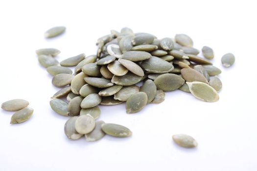 dried pumpkin seeds isolated on white