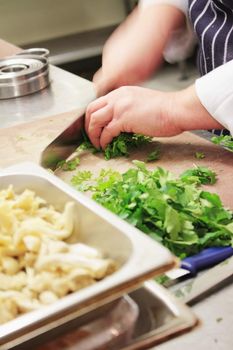 chef chopping parsley