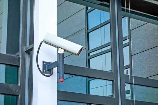 Security camera at modern building facade