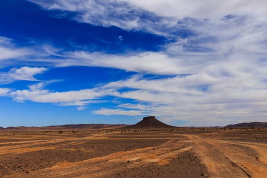 table mountain in the Sahara desert on a background of blue sky, Morocco