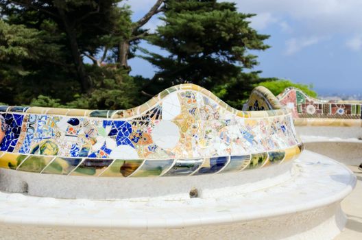 BARCELONA, SPAIN - JULY 13: Ceramic mosaic Park Guell on July 13, 2012 in Barcelona, Spain. Park Guell is the famous architectural town art designed by Antoni Gaudi and built in the years 1900 to 1914