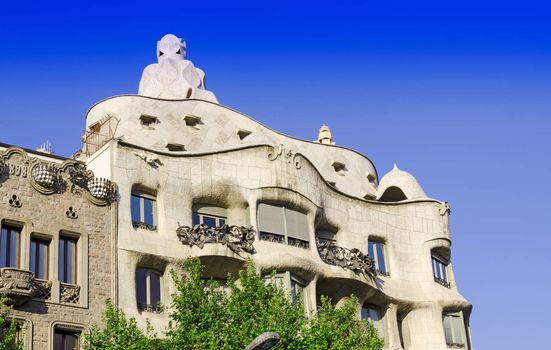 BARCELONA, SPAIN - JULY 13: Modernism style architecture. Casa Mila aka La Pedrera (Catalan for 'The Quarry') on July 19 2012. This house was built during 1906 - 1910.