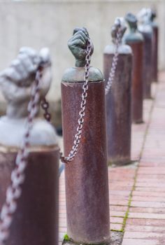 Hands holding a security chain